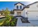 Elegant home entrance with glass paneled double doors and stone accents at 11311 Striped Bass Ct, New Port Richey, FL 34654