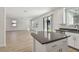 A bright kitchen with a view of the living room and backyard at 11311 Striped Bass Ct, New Port Richey, FL 34654