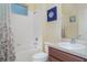 Bathroom with a shower and tub combination, a light fixture, a framed mirror, and a vanity with a sink at 12721 Avelar Creek Dr, Riverview, FL 33578