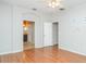 This bedroom boasts wood floors, a ceiling fan, and easy access to the bathroom at 12721 Avelar Creek Dr, Riverview, FL 33578