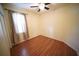 Bedroom featuring a window with curtains and ceiling fan creating a warm, inviting space at 12721 Avelar Creek Dr, Riverview, FL 33578