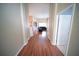 Hallway with hardwood floors leading to living room at 12721 Avelar Creek Dr, Riverview, FL 33578