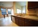 Kitchen with dual sink, stainless steel dishwasher, and view to living spaces at 12721 Avelar Creek Dr, Riverview, FL 33578