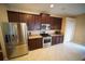 Spacious kitchen with stainless steel appliances, tile floors, and generous cabinet space at 12721 Avelar Creek Dr, Riverview, FL 33578