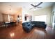 The open-concept living room features a modern table with chairs near the living space at 12721 Avelar Creek Dr, Riverview, FL 33578