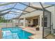 Beautiful backyard area featuring a screened-in in-ground pool and outdoor seating at 12721 Avelar Creek Dr, Riverview, FL 33578