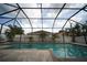 Relax in this backyard with a refreshing pool and covered lanai, all within a screened enclosure at 12721 Avelar Creek Dr, Riverview, FL 33578