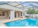 Relaxing screened-in pool area features a beautiful pool, covered lanai and patio area at 12721 Avelar Creek Dr, Riverview, FL 33578