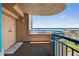 Private balcony with stunning waterfront views, secured with blue railings and featuring an exterior door for easy access at 1540 Gulf Blvd # 2107, Clearwater Beach, FL 33767