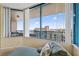 Lounger on balcony with expansive city and water view at 1540 Gulf Blvd # 2107, Clearwater Beach, FL 33767