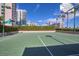 Outdoor basketball court featuring lush green landscaping and palm trees in the background at 1540 Gulf Blvd # 2107, Clearwater Beach, FL 33767