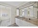 Bright bathroom boasts double sinks, ample counter space, and a doorway leading to the toilet and walk-in shower at 1540 Gulf Blvd # 2107, Clearwater Beach, FL 33767