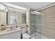 Updated bathroom featuring a walk-in shower with glass door, modern vanity, and fixtures in a clean and bright setting at 1540 Gulf Blvd # 2107, Clearwater Beach, FL 33767