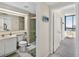 Well-lit bathroom with a modern vanity, walk-in shower, and convenient access to other parts of the house at 1540 Gulf Blvd # 2107, Clearwater Beach, FL 33767