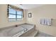 Relax in this luxurious bathtub with a view of the beautiful waterfront and tile surround, a soothing retreat at 1540 Gulf Blvd # 2107, Clearwater Beach, FL 33767