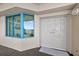 Condo entrance featuring double doors and window with views of the ocean at 1540 Gulf Blvd # 2107, Clearwater Beach, FL 33767
