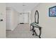 Inviting hallway featuring tiled flooring, decor, and a view of the entryway at 1540 Gulf Blvd # 2107, Clearwater Beach, FL 33767