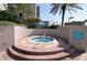 Inviting brick jacuzzi with sparkling blue tile surrounded by tropical foliage at 1540 Gulf Blvd # 2107, Clearwater Beach, FL 33767