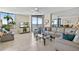 Bright living room with tile floors, ceiling fan, sliding glass doors and comfortable seating at 1540 Gulf Blvd # 2107, Clearwater Beach, FL 33767