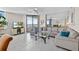 Inviting living room with neutral tones, tile flooring and beautiful views at 1540 Gulf Blvd # 2107, Clearwater Beach, FL 33767