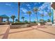 Beautiful patio with walkway to the beach, tall palm trees, and turquoise gazebo at 1540 Gulf Blvd # 2107, Clearwater Beach, FL 33767