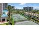 Multiple tennis courts surrounded by landscaping at this beachfront property at 1540 Gulf Blvd # 2107, Clearwater Beach, FL 33767