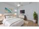 Bright bedroom with a comfortable bed, stylish furnishings, and a ceiling fan at 16304 Wild Mallard Dr, Odessa, FL 33556