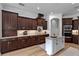 Modern kitchen features stainless steel appliances, granite countertops, and wood cabinets at 16304 Wild Mallard Dr, Odessa, FL 33556