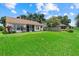 Expansive lawn and screened patio enhance the appeal of this home's backyard at 1741 Elk Spring Dr, Brandon, FL 33511