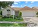 Charming single-story home with a well-manicured lawn and a two-car garage at 1741 Elk Spring Dr, Brandon, FL 33511