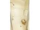A shower stall is equipped with a shower head, grab bar, built-in niche, and a glass door at 2328 Harn Blvd, Clearwater, FL 33764