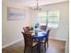 Cozy dining area with a modern chandelier and a view of the outdoors at 2328 Harn Blvd, Clearwater, FL 33764