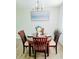 A bright dining room features a round table with seating for four, perfect for intimate meals at 2328 Harn Blvd, Clearwater, FL 33764