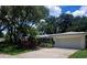 Charming single-story home with mature trees and a well-maintained front yard at 2328 Harn Blvd, Clearwater, FL 33764