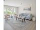 Bright living room featuring a large window and neutral decor at 2328 Harn Blvd, Clearwater, FL 33764