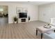 Spacious living room with light wood floors and neutral walls at 2328 Harn Blvd, Clearwater, FL 33764