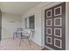 Balcony with seating and door to unit at 2420 Winding Creek Blvd # 209, Clearwater, FL 33761