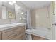 Modern bathroom with a sleek vanity, tiled shower, and contemporary fixtures at 2420 Winding Creek Blvd # 209, Clearwater, FL 33761