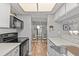 Modern kitchen with stainless steel appliances and a clear view of the adjacent dining area at 2420 Winding Creek Blvd # 209, Clearwater, FL 33761
