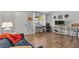 Cozy living room features a modern design with sleek furniture and hardwood floors at 2420 Winding Creek Blvd # 209, Clearwater, FL 33761