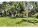 Enjoy the lush greenery and mature trees in this expansive and well-maintained backyard at 2898 Thaxton Dr # 76, Palm Harbor, FL 34684