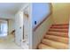 Hallway featuring stairs and bathroom with lots of natural light from sliding glass doors at 2898 Thaxton Dr # 76, Palm Harbor, FL 34684