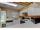 Bright kitchen features white cabinets, countertops, appliances, and a double sink beneath a window with natural light at 2898 Thaxton Dr # 76, Palm Harbor, FL 34684