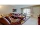 Well-lit living room showcases a cozy seating arrangement and neutral walls at 2898 Thaxton Dr # 76, Palm Harbor, FL 34684