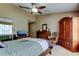 Inviting bedroom equipped with a ceiling fan, a closet, and a window for ample natural light at 2898 Thaxton Dr # 76, Palm Harbor, FL 34684