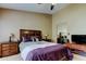 Bright main bedroom showcases a ceiling fan, carpeted floor, and well-placed lamps on bedside tables at 2898 Thaxton Dr # 76, Palm Harbor, FL 34684