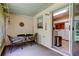Screened patio with table and chairs, with an entrance leading into the kitchen at 2898 Thaxton Dr # 76, Palm Harbor, FL 34684