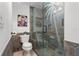 Bathroom features a tiled glass shower door adorned with a whimsical palm tree design at 301 2Nd N St # 14, St Petersburg, FL 33701