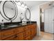 Bathroom featuring a dual sink vanity with granite countertops at 301 2Nd N St # 14, St Petersburg, FL 33701