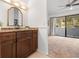 Bathroom vanity with granite countertops and a framed mirror in a spacious room at 301 2Nd N St # 14, St Petersburg, FL 33701